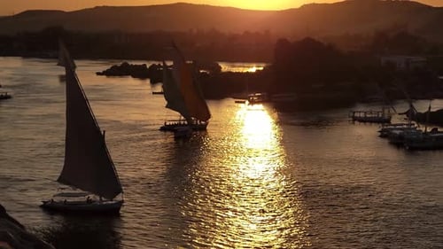 Beautiful Felucca Boats on Nile River Passing By Aswan