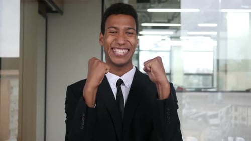 Enthusiastic Man in Suit Celebrates Success