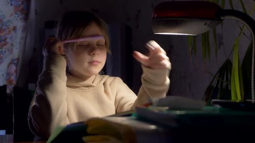 Girl Studying Late at Night at Desk