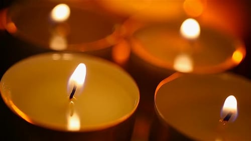 Beautiful Burning Candles Standing on Table in Spa Salon, Time for Relaxation