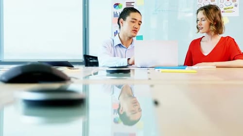 Coworkers Brainstorming in Modern Urban Office