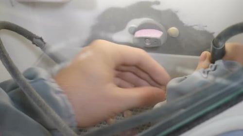 Dental Technician Precisely Crafting Artificial Teeth in Lab