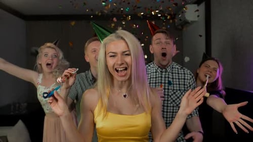 Enthusiastic Friends Celebrate Birthday Party with Confetti