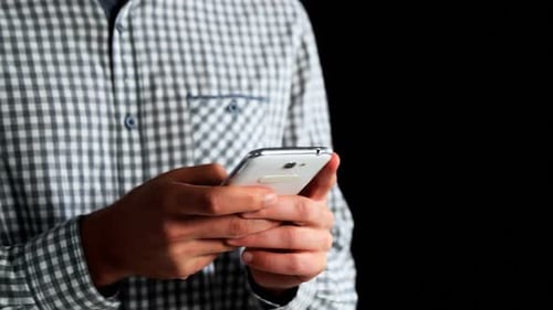 Mid section of man using mobile phone 4k