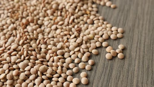 Pile of Nutritious Lentils on Wooden Surface