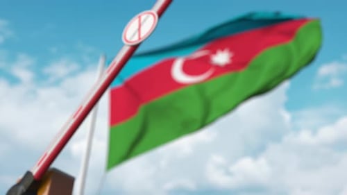 Azerbaijan Border Barrier with Coronavirus Restriction Sign and Flag