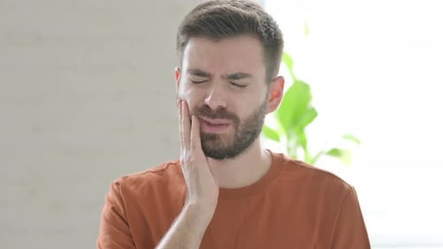 Young Man Having Toothache Cavity