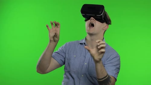 Man Using VR Headset Helmet To Play Game. Watching Virtual Reality 3d 360 Video. Chroma Key