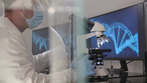 Scientist Using Microscope with DNA Background