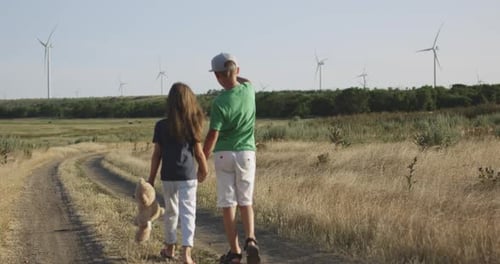 Children Running Over the Camera in Field