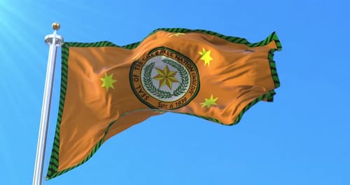 Cherokee Nation Flag Waving against Clear Blue Sky