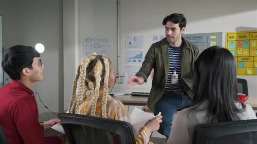 Businessman creative designers present work to the team.Designers a meeting in a modern office.