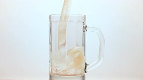 Beer being poured into a beer mug