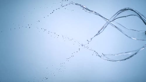 Abstract Shot of Swirling Flowing Water on Light Blue