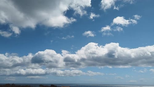 Scenic Clouds Time-Lapse Over Calm Ocean