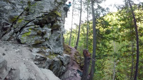 Rock climber climbing a cliff