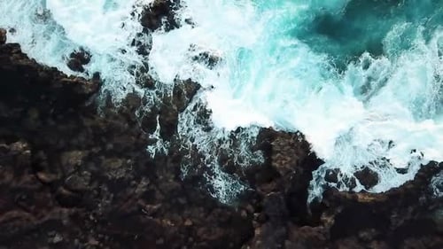 Big blue wave splash near the beach in the ocean - summer vibes and vacation concept