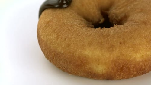 Delicious Donut Covered with Chocolate Sauce