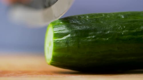 Slicing Fresh Cucumber with a Sharp Knife