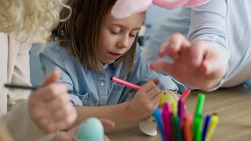 Video of family during painting Easter eggs at home. Shot with RED helium camera in 8K