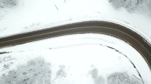 Drones Eye View Winding Road From the High Mountain Pass in Winter