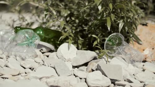 Environmental Pollution: Plastic Litter on Rocky Beach