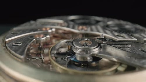 Intricate Gears of Watch Turning Slowly