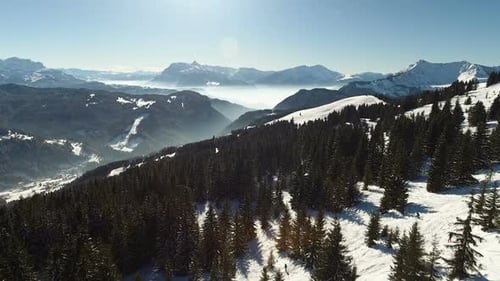 Snowy Mountain Range Aerial on Sunny Winter Day