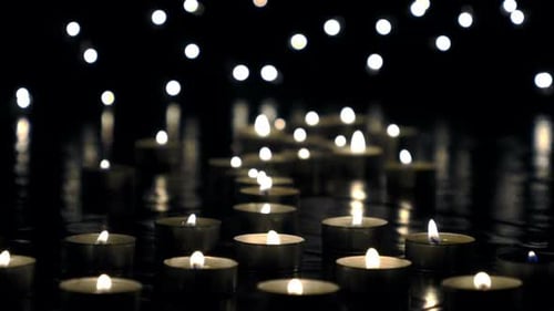 Candles Burning in the Dark Background