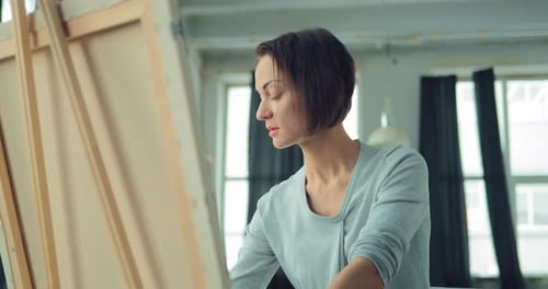 Woman Painting on Canvas in Art Studio