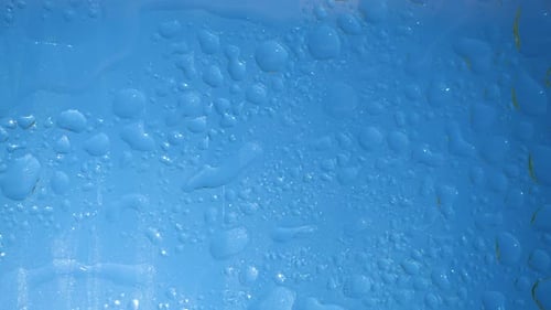 Rain Water Droplets on Blue Surface