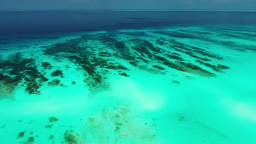 Aerial drone view nature of tropical tourist beach voyage by blue lagoon with white sand background