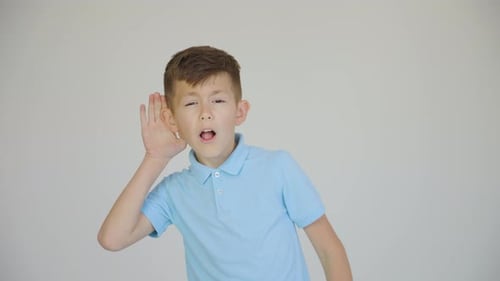 Curious Little Caucasian Boy Holding Hand Near Ear and Overhearing Gossips