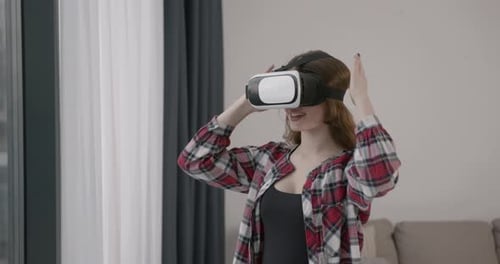 Young Adult Using Virtual Reality Headset Indoors