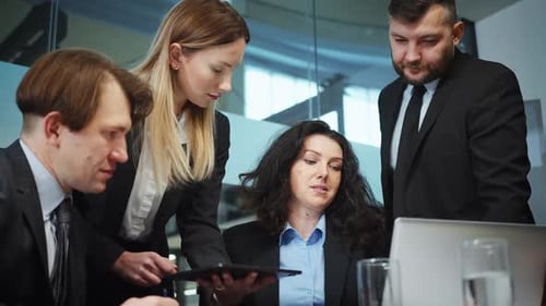 Business Team Discussing Plans in Modern Office