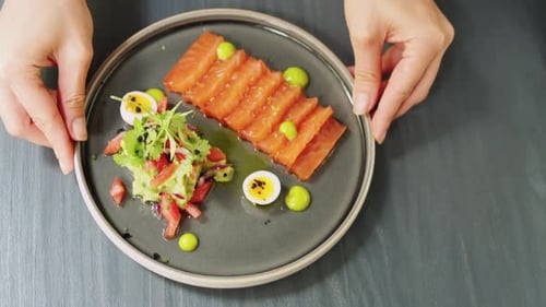 Gourmet Salmon Dish with Avocado and Greens