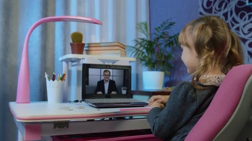 Girl Pupil Doing School Homework with Man Teacher Using Laptop Computer at Home Distance Education