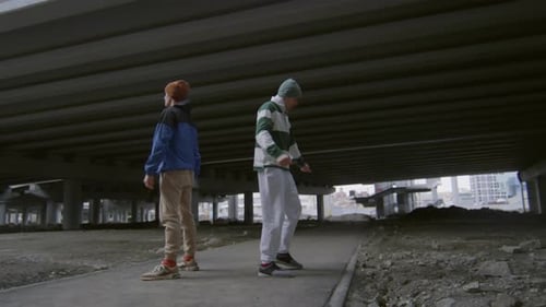 Two Guys Performing Epic Parkour Stunt on Street