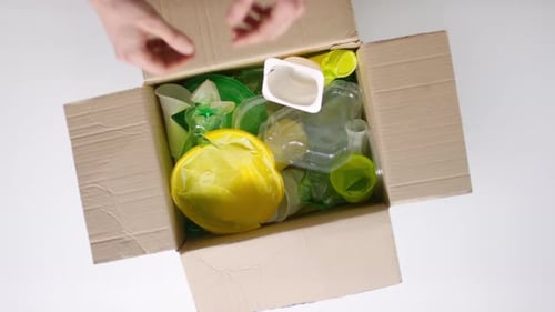 Box Filled with Plastic Waste for Recycling