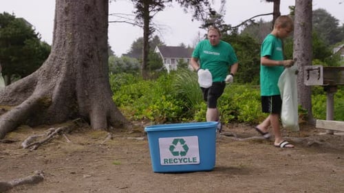 Group of volunteers cleaning up park