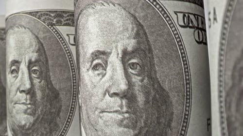 American one hundred dollar paper banknote in close up macro view dolly shot.