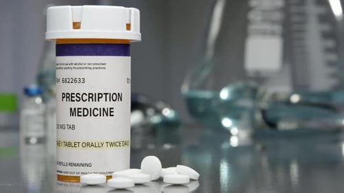 Prescription Medicine Bottle and Pills Close Up