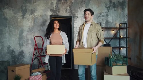 Young Couple Moving Into New Home Together