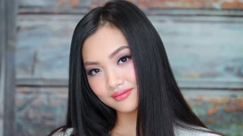 Young Woman Posing with Long Black Hair