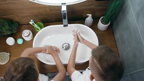 Children Washing Hands with Soap at Modern Sink