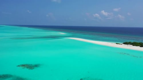 Aerial flying over nature of perfect shore beach vacation by blue ocean with white sand background o