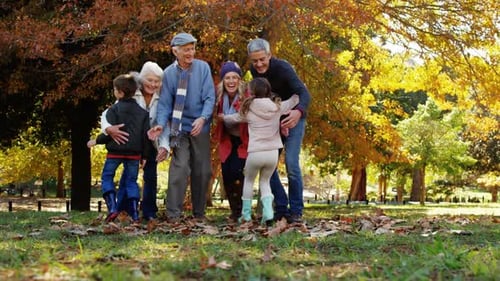 Happy Family Together in Autumn Park