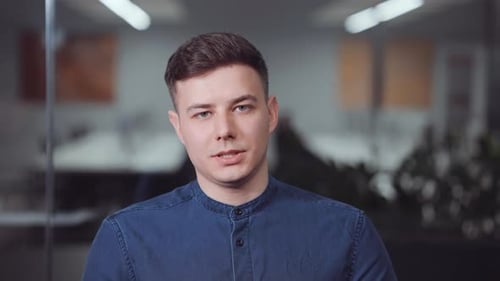 Young Adult Talking in Modern Office Setting