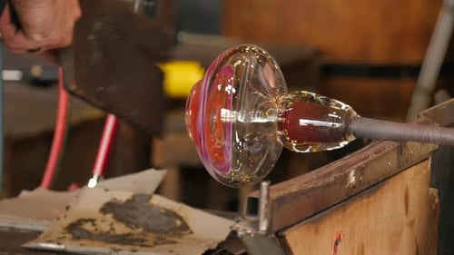 Glassblower Shaping Molten Glass into Art