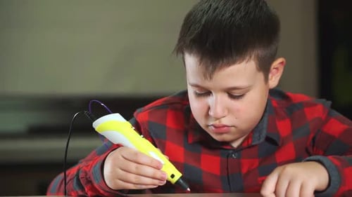Boy Creates with 3D Printing Pen at Home